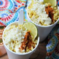 Esquites · Mayo, cheese, chili pepper powder and lime wedge.