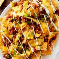 Loaded Nachos · Cheese, chili meat sauce, tomatoes, jalapenos and sour cream.