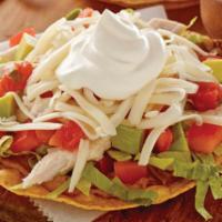 Tostadas with 2 Meats · Refried beans, lettuce, tomatoes, sour cream and cheese.
