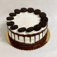Oreo Cake · 4 layers of chocolate cake. Oreo cream filling. Oreo cream sprinkled with Oreo crumbs and to...