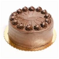 Chocolate Fudge Cake · 4 layers of chocolate cake. Fudge filling. Chocolate buttercream frosting with chocolate chi...