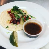 Tacos · 1 corn street taco filled with the meat of your choice, topped with chopped onion, cilantro,...