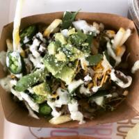 Carne Asada Fries · French fries topped with cheese, smothered in green chili, asada, onions, jalapenos, cilantr...