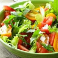 House Salad · Mixed greens, cherry tomatoes, onion and cucumbers tossed in lemon dressing.