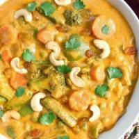 Vegetable Korma Gluten free.  · Fresh mix vegetables and paneer cooked with cashew, raisin, and cream.