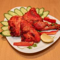 Chicken Tandoori Halal, gluten free.  · Spring chicken marinated in yogurt and spices, then broiled over a charcoal flame.