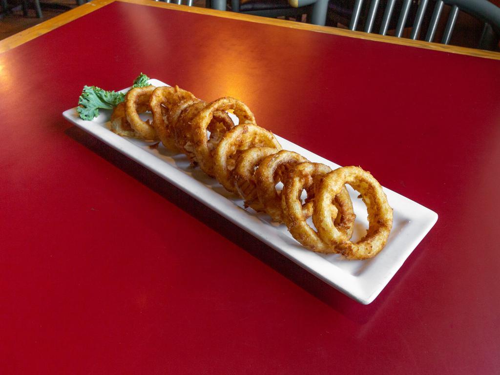 House-Made Onion Rings · Hand-breaded onion rings fried golden brown.