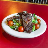 Black and Bleu Steak Salad · Sliced sirloin, mixed greens, tomatoes, bacon, and bleu cheese crumbles. Add avocado for an ...
