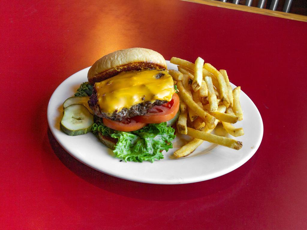 6 oz. Hand Pattied Fresh Ground Beef Burger · On a fresh-baked bun and served with chips. Sub fries, soup, or salad for additional charges. Add cheese, bacon, lettuce, tomato, onion for additional charges.