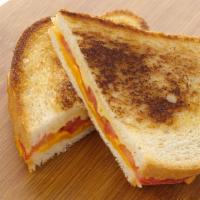 Grilled Cheese Sandwich · Tomato, provolone, and cheddar on sourdough bread. Add meat for an additional charge. with c...