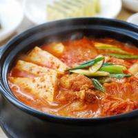 A22. Kimchi Jjigae · Kimchi stew with slices of pork.