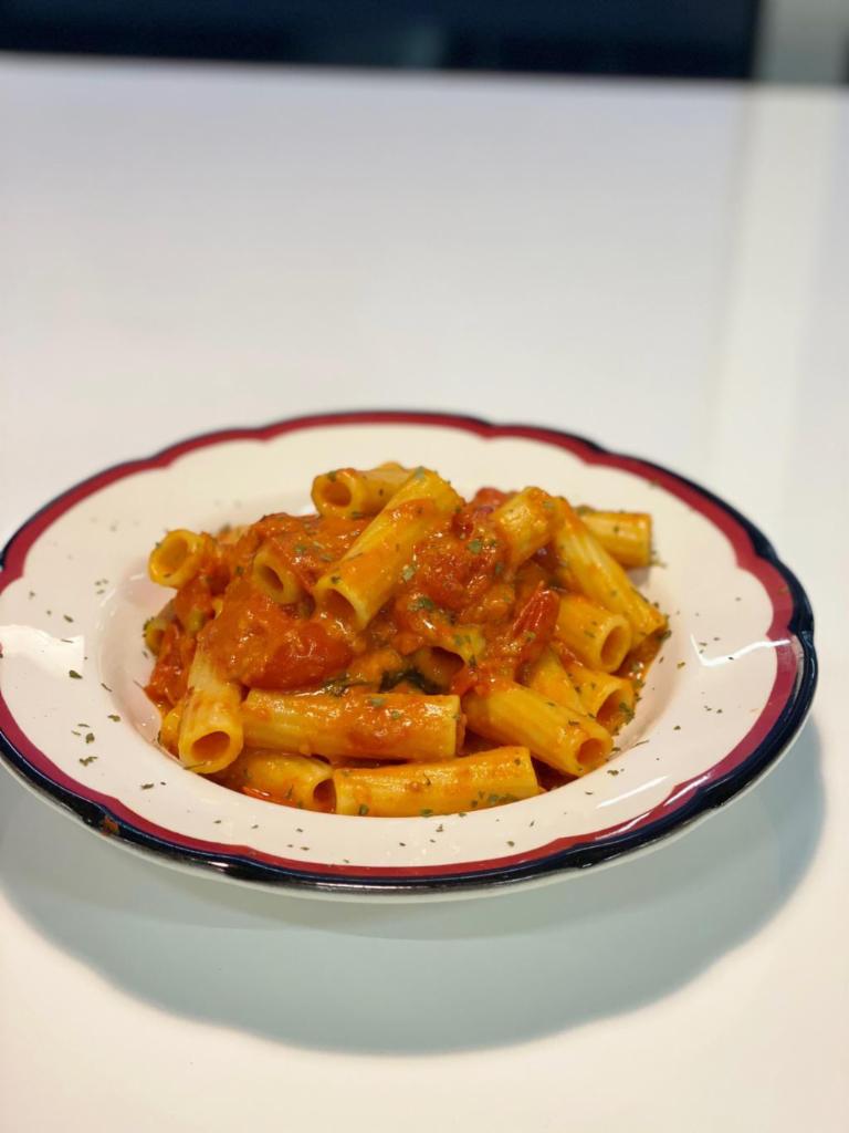 Rigatoni Prince of Naples · A traditional Italian favorite. Rigatoni sauteed with our homemade pork infused with marinara sauce and with a blend of provolone, mozzarella and parmigiano cheeses.