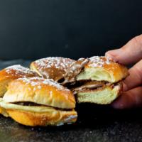 Nutella Brioche · A sweet brioche bun filled with Nutella spread and topped with powdered sugar