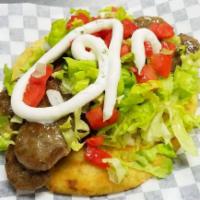 Gyro · Grilled lamb or chicken on buttery toasted pita bread
Served with Tashiki Sauce, onions,  le...