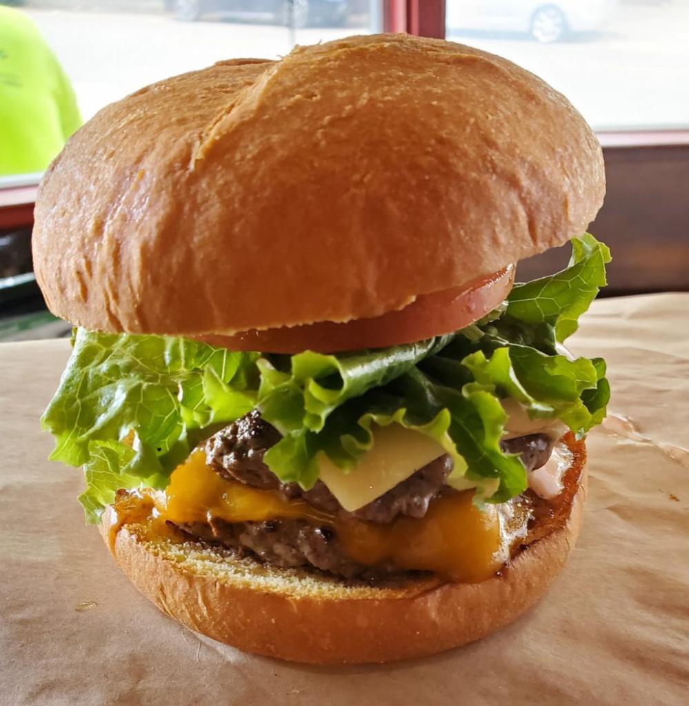 Double Decker Burger · Our special seasoned double All-Natural Angus beef patty topped with Swiss and cheddar cheese.
