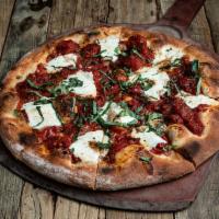 Margarita Pizza · Roasted tomatoes, fresh mozzarella, olive oil, basil.