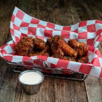 Crispy Fried Chicken Wings · Szechuan, Buffalo, berbere dry rub.