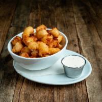 Cheese Curds · Served with white cheddar curds, BBQ, ranch, or Heinz.
