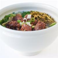 Pu-Erh Flavored Beef Stew Noodle Soup · Savory light broth with noodles.