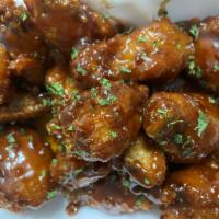 Chicken Wings · Crispy wings tossed in your choice of sauce. The BEST wings in Michigan!