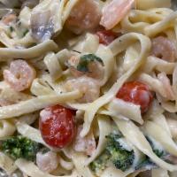 Shrimp Fettuccine Alfredo Pasta · Spinach, cherry tomatoes, shrimp in our old bay spicy alfredo sauce and topped with shredded...