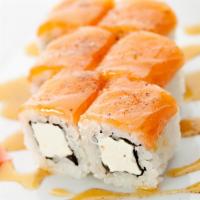 JB roll · Inside-out roll topped with fresh Atlantic salmon mix, filled with Philadelphia cream cheese...
