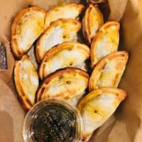 10 Appetizer Size Empanadas · Choose (10) from our 6 flavors=  Ground Beef, Spicy Ground Beef, Spicy Chicken, Spinach and ...