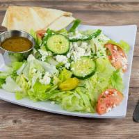 Greek Salad · Garden salad topped with feta cheese, black olives and pepperoncini peppers.