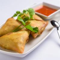 Samosas · Vegetarian. Flour turnover filled with potatoes, red onions, peas, carrots, and a blend of u...