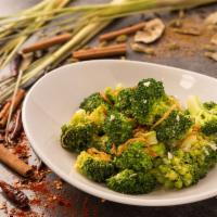 Broccoli and Garlic · Broccoli tossed in wok with white wine, garlic, and ginger garnished with fried onions.