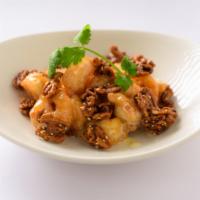 Walnut Shrimp · Lightly fried shrimp wok tossed with a creamy sweet sauce topped with candied walnuts and se...