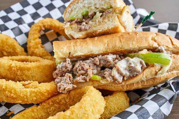 Philly Sub · Steak or chicken served with mayo, onions, Swiss cheese and green bell peppers. Includes fries.