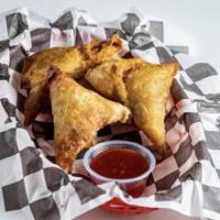Samosa (3 pcs) · Savory chicken or beef filling rolled in a triangle cut flaky pastry and deep-fried until cr...