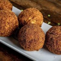 Scotch Egg · Boiled egg wrapped in ground sausage meat and deep-fried until brown.