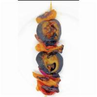Snail Kebab · Seasoned grilled snail arranged in a kebab stick layered with assorted bell peppers and onio...