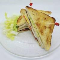 Club Sandwich · Toasted bread layered with ground chicken or beef, lettuce, and tomatoes, and our house’s sp...