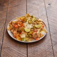 Nachos Grande · Chips topped with refried beans, Jack cheese, choice of meat, tomatoes, diced avocado, jalap...