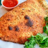 Cheese Calzone · Ricotta and grated mozzarella. Served with a cup of sauce.