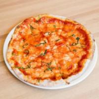 Margherita Pizza · Tomato, mozzarella, fresh basil and touch of Parmigiano Reggiano.