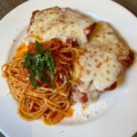 Petto di Pollo alla Parmigiana · Organic chicken breast pounded and breaded, fresh mozzarella and house pomodoro. Served with...