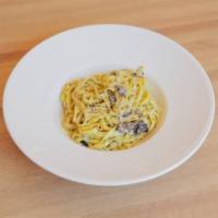 Tagliolini al Tartufo Nero · Fresh tagliolini, black truffle cream sauce, truffle pate, shallots and drizzled with truffl...
