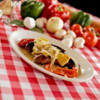 Sausage and Peppers · Grilled Italian sausage and colorful bell peppers finished off in a white wine sauce.
