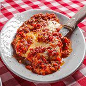 Chicken Parmesan · Breaded chicken breast topped with Parmesan and mozzarella cheese, covered in a meat sauce a...