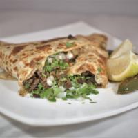 Quesadilla · Fresh flour tortilla stuffed with cheese and your choice of meat.