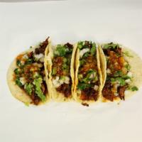 Home Made Tacos · Soft homemade corn tortilla, your choice of meat, garnished with onions, cilantro, and our s...