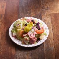 Antipasto Salad · Fresh iceberg lettuce, tomatoes, and cucumbers with ham, salami, provolone cheese, black oli...