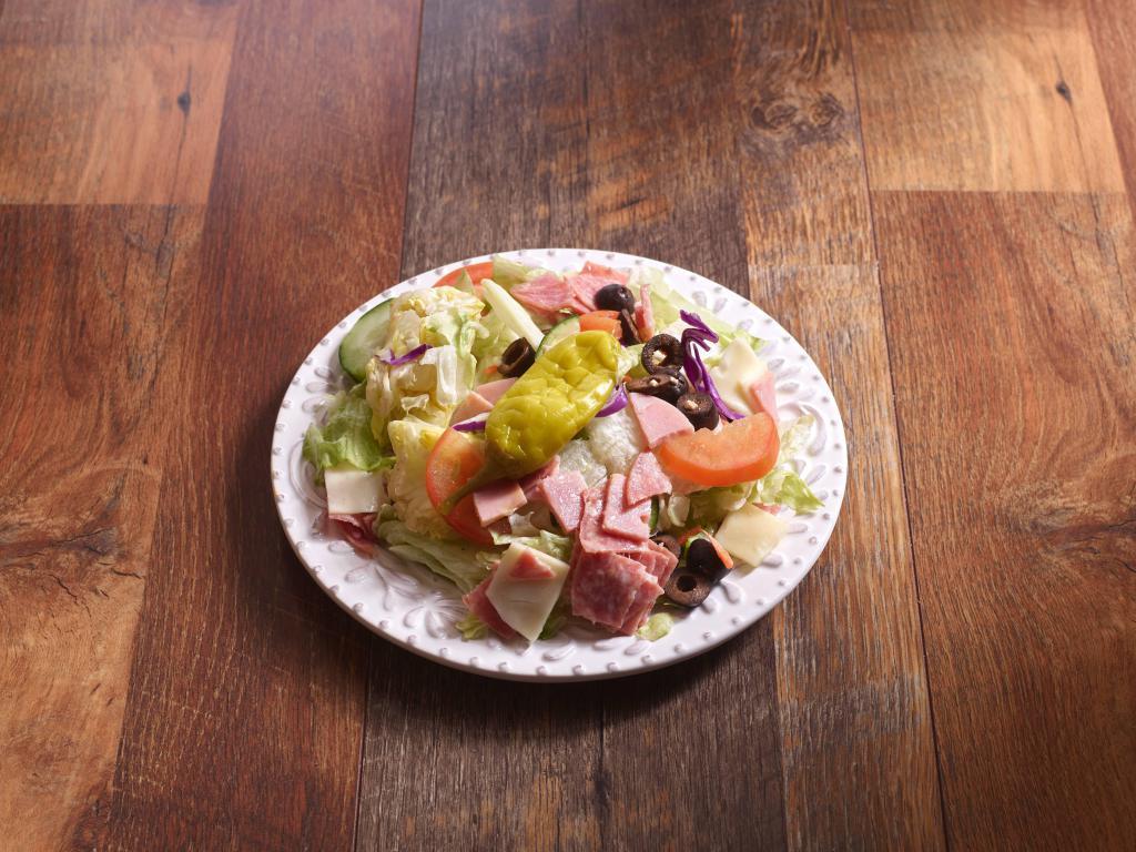 Antipasto Salad · Fresh iceberg lettuce, tomatoes, and cucumbers with ham, salami, provolone cheese, black olives, and pepperoni. Served with house Italian dressing.