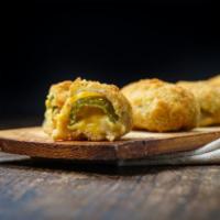 Jalapeno Poppers · Jalapenos stuffed with cheese then crisped to perfection.