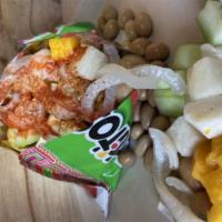 Tostilocos · Tostitos chips, pig skin, covered peanuts, jicama and cucumber tajin, chamoy and lime juice,...