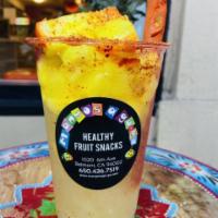 ChamPiña · Pineapple trocitos (pieces of fruit), homemade pineapple syrup, shaved ice, chamoy, tamarind...